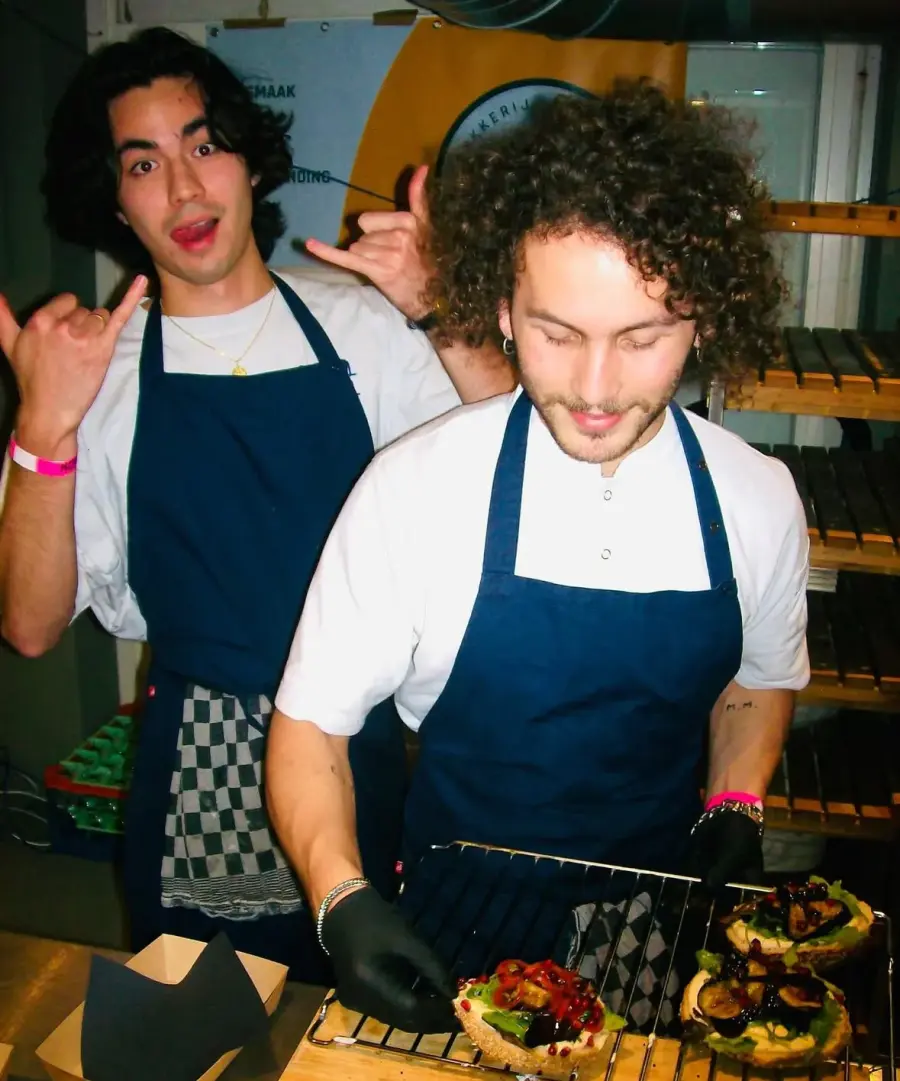 bagel bagel team plating fresh bagels behind the counter